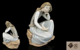 Nao by Lladro - Large Porcelain Figurine - Thoughtful Young Woman Seated on a Rock,