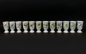 A Set of 12 Japanese Ceramic Goblets, 'Oiseaux Chanteurs De L'Europe, all decorated with various