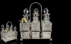 A Cut Glass And Stainless Steel Cruet Set Six piece vintage set in rectangular silver tone holder