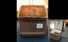 A Dusky Rose Coloured Velour Pouffe with fringed edging and hinged lid.