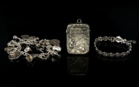 A Vintage Silver Charm Bracelet Chain bracelet loaded with over 10 charms to include, acorn,