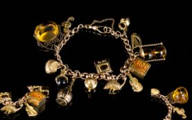 Antique Period 9ct Rose Gold Bracelet loaded with thirteen 9ct gold charms of nice quality.