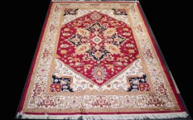A Very Large Woven Silk Carpet Ornately patterned Heriz rug with pale gold ground and traditional