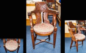 Victorian Period - Unusual and Superior Carved Walnut Arm Chair with Circular Tip Over Upholstered