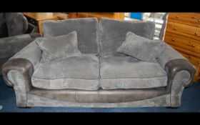 A Large Contemporary Two Seater Sofa Complete with matching scatter cushions,
