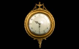 Early 20th Century Neoclassical Style Wall Clock Circular clock with cream dial and black figuring