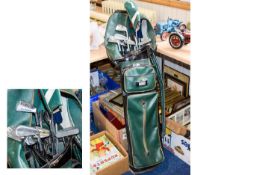 A Set Of Various Golf Clubs And Golf Bag.