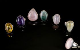 A Collection Of Silver And Crystal Set Rings Six items in total to include large rose quartz oval