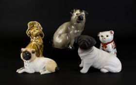 A Collection Of Pug Figurines Five in total to include resin seated pug,