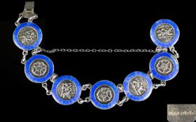Superb Quality- 1940's Silver And Blue Enamel Set Bracelet. The roundel's showing embossed images of