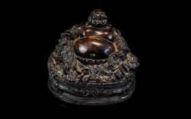An Ornate Buddha Figure Large figure of seated Buddha swathed in highly ornamented robes. 4.