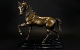 Large Bronze Sculpture Of A Stallion, Raised On A Marble Base.