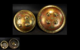 Antique Indo-Persian Decorative Shields Two circular brass shields with ornate etched patterning