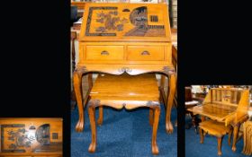 Oriental Carved Bureau Hinged top section above two small drawers and carved apron.