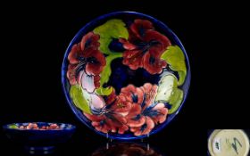 Moorcroft Signed and Impressive Large Tube lined Footed Bowl ' Hibiscus ' Design on Blue Ground. c.