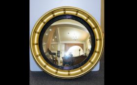 Antique Gilded Circular Convex Mirror Regency style mirror in deep gilt and gesso frame with