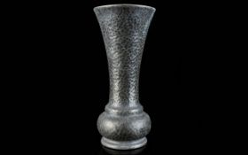A Tudric Hammered Pewter Trumpet Vase Of