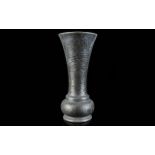 A Tudric Hammered Pewter Trumpet Vase Of