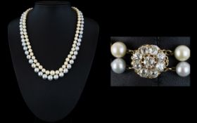 A Natural Pearl Double Strand Necklace With 18ct Gold And Diamond Clasp Exquisite necklace, circa