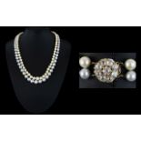 A Natural Pearl Double Strand Necklace With 18ct Gold And Diamond Clasp Exquisite necklace, circa