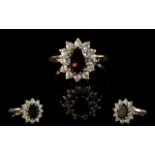 A Vintage 9ct Gold Attractive Garnet And Diamond Set Cluster Ring. Flower head design.