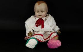 Heinrich Handwerch Composite Head Doll Circa late 1900, with felt body, bisque head,