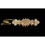 George V 9ct Two Tone Gold Sweetheart Brooch. Fully hallmarked for 9ct with attached safety chain.