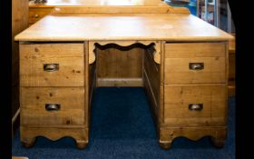 A Pitched Pine Kneehole Desk Large desk with rustic patina,