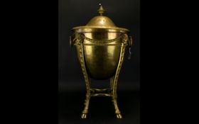 A Nineteenth Century NeoClassical Brass Coal Bucket Floor standing coal bucket with Rams head masks,