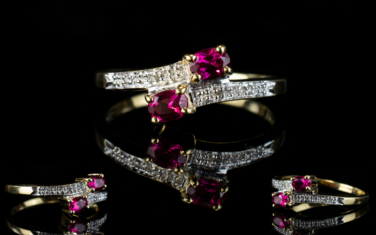 Ladies 9ct Gold Twin Snake Eyed Ruby And Diamond Set Dress Ring. Fully hallmarked for 9ct Gold.