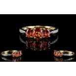 9ct Gold Diamond and Fire Opal Three Stone Dress Ring the three fine ovals of excellent colour,