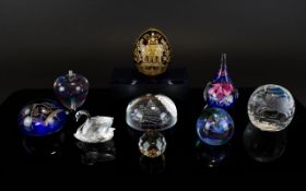 A Good Collection of Vintage Glass Paperweights plus a Swarovski crystal swan figure.