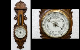 A Late Nineteenth/Early Twentieth Century Carved Walnut Barometer Carved acanthus frame,