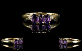 Ladies 9ct Gold Three Stone and Diamond Dress Ring the three amethysts of excellent colour and