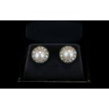 18ct White Gold Natural Pearl And Diamond Earrings A pair of white gold stud earrings set with