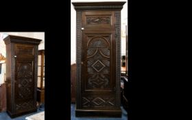 Jacobean Style Carved Hall Cupboard Circa early 20th century, with storage above single door,