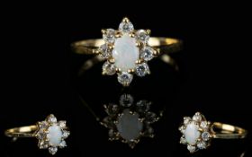 Ladies 1970's 9ct Gold Opal and Diamond Set Cluster Ring Flower head design. The central Opal