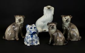 A Collection of Five Ceramic Pug Figures,