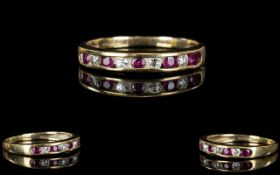 9ct Gold - Attractive Ruby and Diamond Set Dress Ring. Fully Hallmarked.