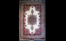 A Large Persian Carpet Very large heavyweight woven wool rug in traditional floral and foliate