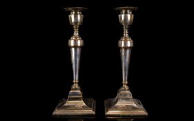 Antique Plated Metal Candlesticks A pair of white metal candlesticks of neoclassical form with
