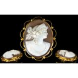 9ct Gold Mounted Shell Cameo Brooch with attached 9ct gold safety chain. Marked 9ct.