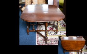 Mahogany Drop Leaf Table Of Plain Form. Aged Patina. Barley twist legs and supports.