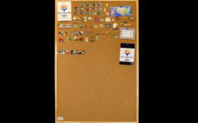 Winter Olympic Interest Salt Lake 2002 Collection Of Enamel Pin Badges Displayed on cork board,