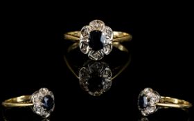 18ct Gold Sapphire and Diamond Set Dress Ring. The Sapphire Surrounded by Diamonds.