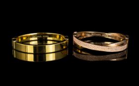 Two Michael Kors Bangles. The first in r