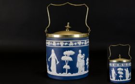 Jasper Ware Blue and White Biscuit Barrel with silver plated lid and handle. The barrel decorated