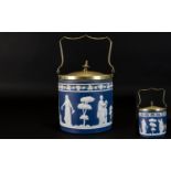 Jasper Ware Blue and White Biscuit Barrel with silver plated lid and handle. The barrel decorated