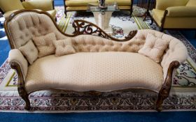 Antique Chaise Lounge featuring Carved Back, Apron and Arm Rests Plush Button Back and Matching