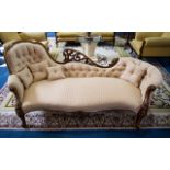 Antique Chaise Lounge featuring Carved Back, Apron and Arm Rests Plush Button Back and Matching